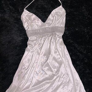 White silk halter dress with a bidazzled band